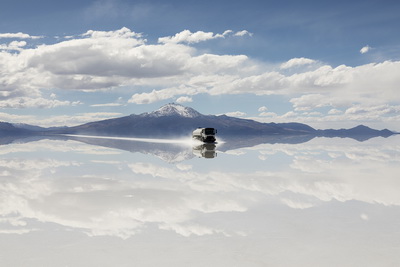 Energy oxymoron. A tank truck transporting fuel crosses the Salar de Uyuni, Bolivia. The Salar is considered the largest lithium reserve in the world. With lithium, batteries are manufactured to integrate decentralized renewable sources when the sun does